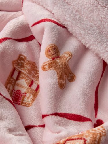 Rózsaszín karácsonyi mézeskalácsos polártakaró masnival – puha, ünnepi pléd